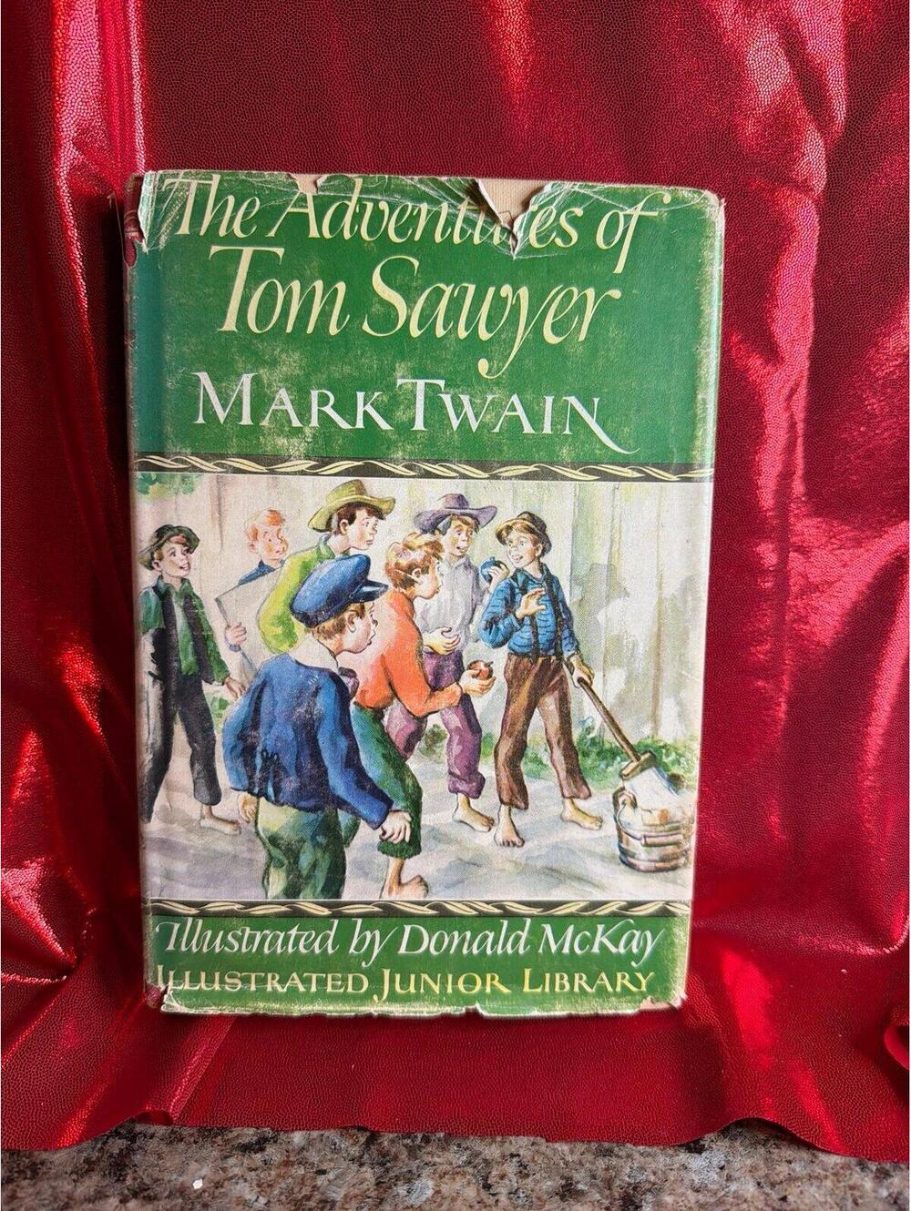 Book vintage edition is The Adventures of Tom Sawyer by Mark Twain, published in